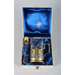 A RUSSIAN PIERCED AND NIELLO SILVER BEAKER AND SPOON with cut glass in original fitted case.