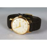 AN 18CT GOLD LONGINES AUTO WRISTWATCH with leather strap.