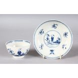 AN 18TH CENTURY WORCESTER TEA BOWL AND SAUCER painted in under-glaze blue with the Waiting