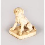 A GOOD EUROPEAN IVORY FIGURE OF A SEATED DOG, 2.25ins high.