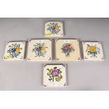 A SET OF SIX POOLE POTTERY FLORAL TILES, Circa. 1920-1930. 5ins square. Provenance: Bonhams.