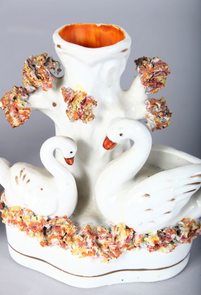 A STAFFORDSHIRE SWAN SPILL VASE with two swans and tree stump, on a shaped, encrusted base, 4. - Image 3 of 3