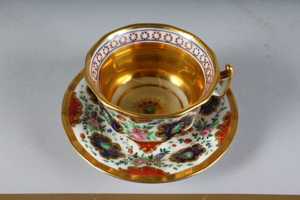 A FRENCH CUP AND SAUCER painted with flowers. - Image 2 of 2