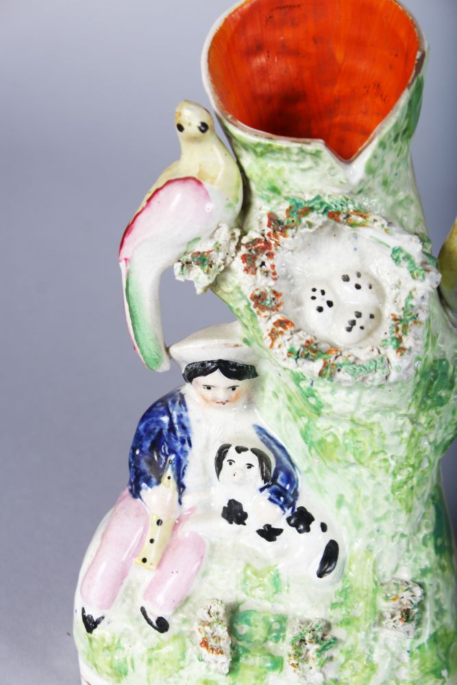 TWO STAFFORDSHIRE SPILL VASES, young Scottish girl with swan and Scottish boy with a dog (2). 7ins - Image 2 of 2