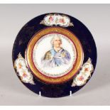 A SEVRES PORCELAIN PLATE, painted with a portrait of LOUIS XV. 9.5ins diameter.