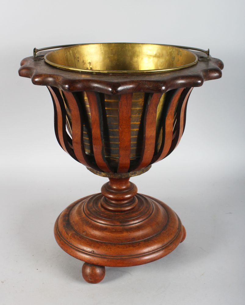 A DUTCH MAHOGANY BUCKET with brass liner.