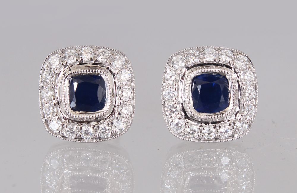 A PAIR OF 18CT WHITE GOLD, SAPPHIRE AND DIAMOND CLUSTER EARRINGS of 1.4CTS.