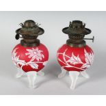 A SUPERB PAIR OF "WEBBS" STYLE RUBY CAMEO OIL LAMP BASES with flowers, thistles and leaves, each