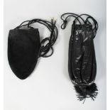A PRADA BLACK LEATHER BAG and A VELVET BLACK BAG.