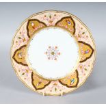 A 19TH CENTURY COPELAND PLATE painted in a Middle Eastern inspired design with birds in gilt