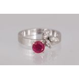A 14CT RUBY AND DIAMOND RING.
