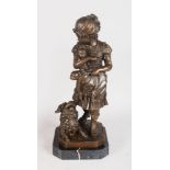 F. BARBEDIENNE A BRONZE OF A YOUNG GIRL holding two puppies, a dog at her side. Signed. 18ins high.