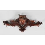 A CARVED WOOD BLACK FOREST OWL COAT RACK. 16ins long.