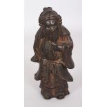 A SMALL CHINESE MING DYNASTY BRONZE STANDING FIGURE OF GUANDI, with fierce expression and stroking