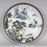 A LARGE CHINESE PORCELAIN RIVER LANDSCAPE DISH, of saucer shape, the base with an iron-red China