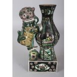 A 19TH CENTURY CHINESE FAMILLE NOIRE PORCELAIN VASE GROUP, in the form of a Buddhistic lion on a