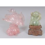 A CHINESE ROSE QUARTZ MODEL OF AN ANGEL FISH, 3.25in long; together with a small celadon jade figure