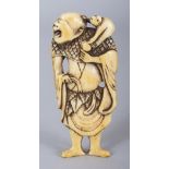 A JAPANESE EDO/MEIJI PERIOD IVORY NETSUKE OF A STANDING SENNIN, a monkey perched on his shoulder,