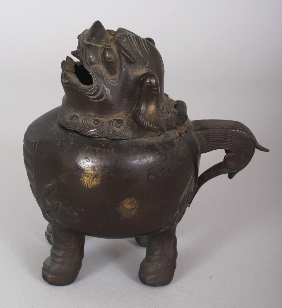 A CHINESE MING STYLE BUDDHISTIC LION BRONZE CENSER, the hinged head of the mythical animal forming