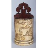 AN UNUSUAL CHINESE WOOD & IVORY WALL POCKET, the semi-circular side carved with a scene of two sages
