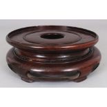 ANOTHER CHINESE CIRCULAR WOOD VASE STAND, with a simple pierced frieze, 8.2in wide at widest