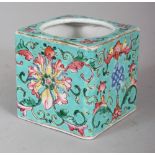 A 19TH CENTURY CHINESE TONGZHI MARK & PERIOD TURQUOISE GROUND FAMILLE ROSE CUBE FORM PORCELAIN WATER