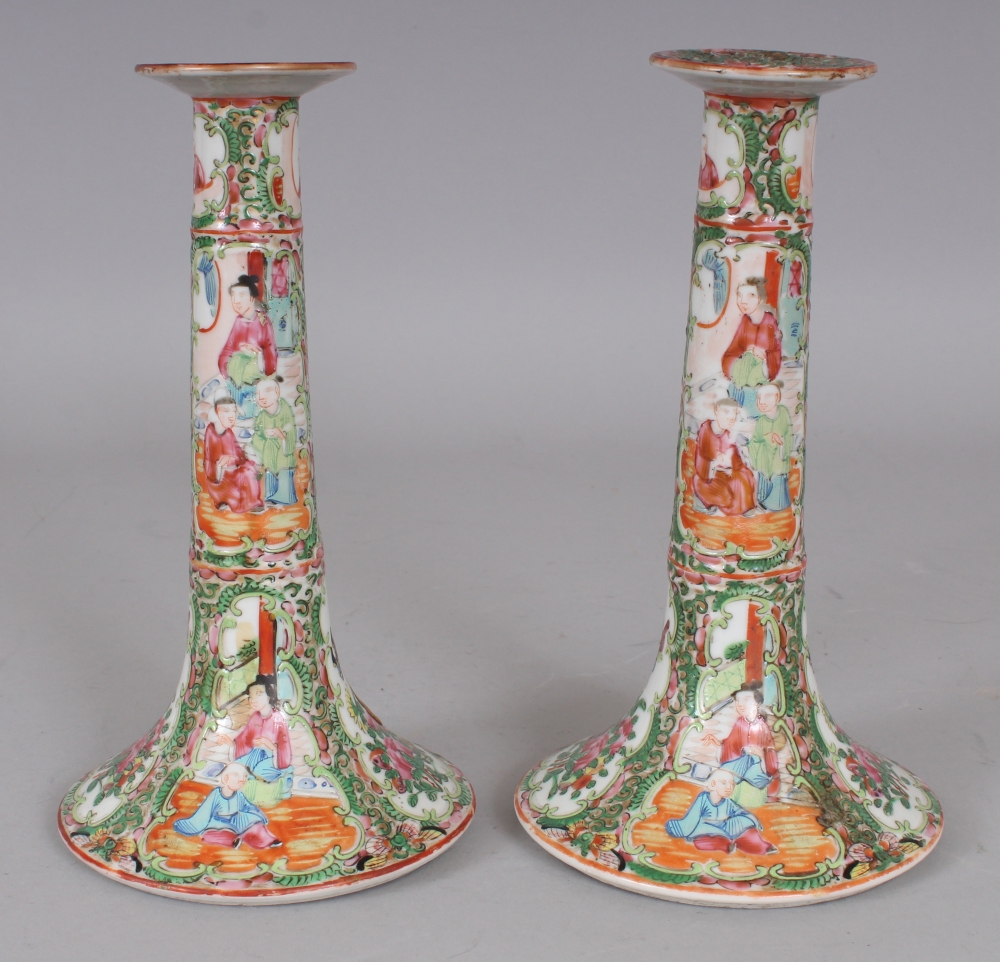 A PAIR OF 19TH CENTURY CHINESE CANTON PORCELAIN CANDLESTICKS, 8.2in high.