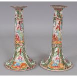 A PAIR OF 19TH CENTURY CHINESE CANTON PORCELAIN CANDLESTICKS, 8.2in high.