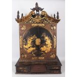 A FINE 18TH CENTURY CHINESE EXPORT GILT DECORATED LACQUERED WOOD CABINET ON STAND, circa 1730,