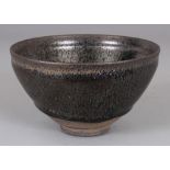 A CHINESE SONG STYLE JIAN WARE OIL SPOT GLAZED CERAMIC TEA BOWL, the glaze falling well short of the