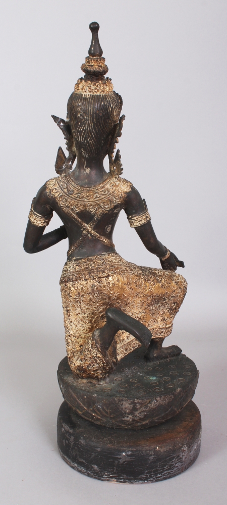 A 20TH CENTURY THAI GILT BRONZE OF A KNEELING THEPHANOM FIGURE, supported on a circular carved - Image 2 of 4