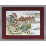 A CHINESE WOOD FRAMED PORCELAIN PLAQUE, depicting a lakeside palace, the frame 16.75in x 12.75in.