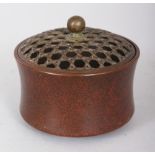 A SMALL CHINESE CIRCULAR BRONZE CENSER & PIERCED LATTICE COVER, weighing approx. 465gm, the base