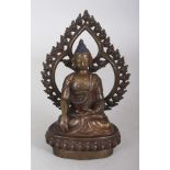A 19TH CENTURY TIBETAN BRONZE FIGURE OF BUDDHA, seated in dhyanasana on a lotus plinth before a