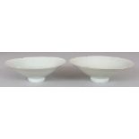 A PAIR OF CHINESE SONG STYLE QINGBAI PETAL MOULDED CONICAL PORCELAIN BOWLS, each base unglazed, 5.