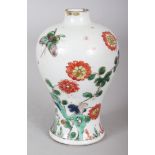 A SMALL CHINESE KANGXI PERIOD FAMILLE VERTE BALUSTER PORCELAIN VASE, circa 1700, 5in high.