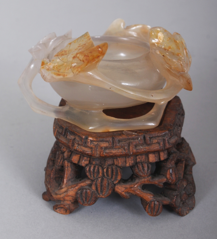 A SMALL CHINESE AGATE BRUSHWASHER, together with a fitted wood stand, carved in relief with - Image 2 of 7