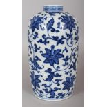 A CHINESE MING STYLE BLUE & WHITE PORCELAIN VASE, decorated with formal scrolling foliage, the