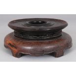 ANOTHER CHINESE CIRCULAR WOOD VASE STAND, 7in wide at widest point, to support a vase with a foot