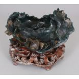 A GOOD CHINESE DARK GREEN JADE-LIKE HARDSTONE LOTUS BRUSHWASHER