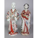 A LARGE PAIR OF 18TH CENTURY JAPANESE IMARI EDO PERIOD PORCELAIN FIGURES, of a standing gentleman