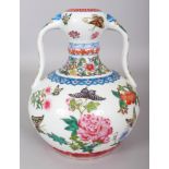A CHINESE FAMILLE ROSE TWO HANDLED PORCELAIN BUTTERFLY VASE, the base with a Qianlong seal mark, 7.