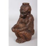 AN EARLY 20TH CENTURY JAPANESE BRONZED CERAMIC MODEL OF A MONKEY, squatting and holding a bowl, 6.