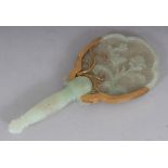 A 20TH CENTURY CHINESE CELADON JADE-LIKE HARDSTONE CARVING OF HAND MIRROR FORM, with gilt-metal