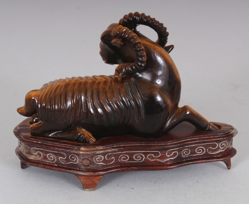 A CHINESE TIGER’S EYE STONE MODEL OF A RAM, together with a fitted wire-inlaid wood stand, 2.75in - Image 3 of 7