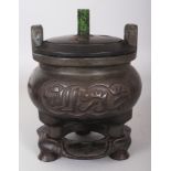 A CHINESE ISLAMIC MARKET BRONZE CENSER ON STAND, with a fitted wood stand and a fitted pierced