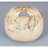 AN UNUSUAL JAPANESE MEIJI PERIOD IVORY NETSUKE OF A MOKUGYO TEMPLE DRUM, entwined with lotus and