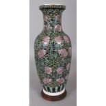 AN EARLY 20TH CENTURY CHINESE ART NOUVEAU STYLE PORCELAIN VASE, together with a fitted wood stand,