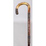 A HORN HANDLED BAMBOO WALKING STICK, with an engraved and hallmarked silver waistband and a matching