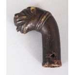 AN INDO-PERSIAN MUGHAL BRONZE CANE HANDLE, cast in the form of a tiger’s head, 2.75in high.